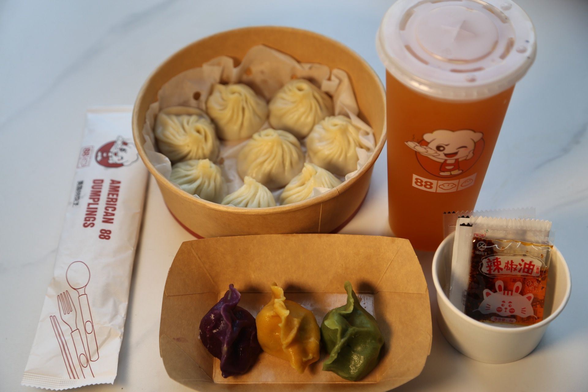 C. Soup Xiao Long Bao (8Pcs) + Humb Size Pan Fried Bun (5Pcs) + Hot And Sour Soup